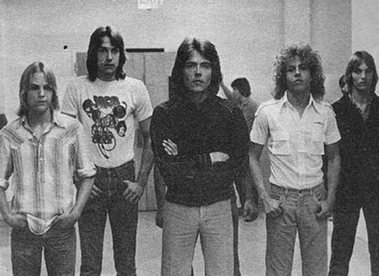 Tad Painter, Morgan Ferguson, Mark Wheeler, Mark Ridlen and John Painter portrayed members of the band Rapid Fire in Ron Howard’s 1978 TV movie “Cotton Candy.” In real life, their band was called Quad Pi.