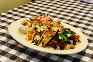 Fill up on grilled tilapia tacos at Flying Fish and help make a child's Christmas bright by bringing a toy, too: Flying Fish/Facebook