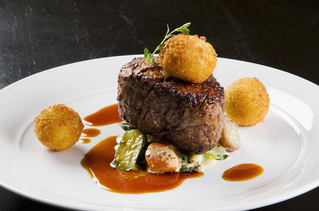 Chris Ward's 9-ounze filet of beef with potato fritter, grain mustard vegetables and Porcini sauce