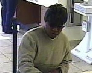 'Bad Hair Bandit' is so named for wearing cheap wigs during his crimes (FBI photo) 