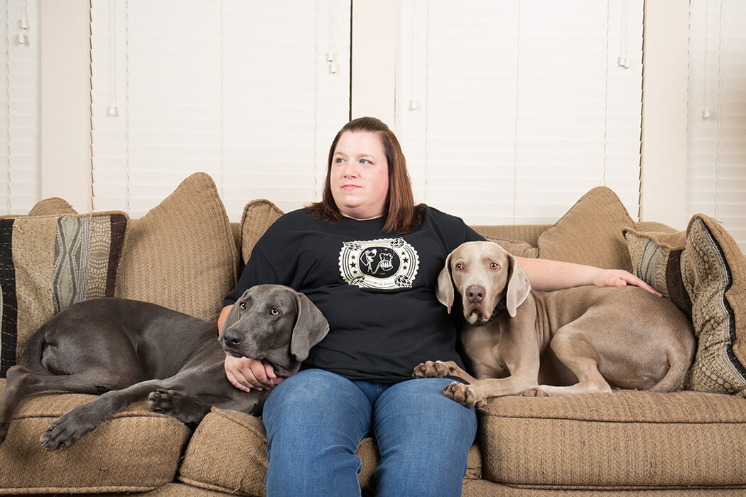 Julie Roller, with dogs Earl and Daisy, has spent more than five years with Weimaraner Rescue of Texas. The non-profit organization started in 1997 and have rescued more than 2,600 weimaraners. (Photo by Rasy Ran)