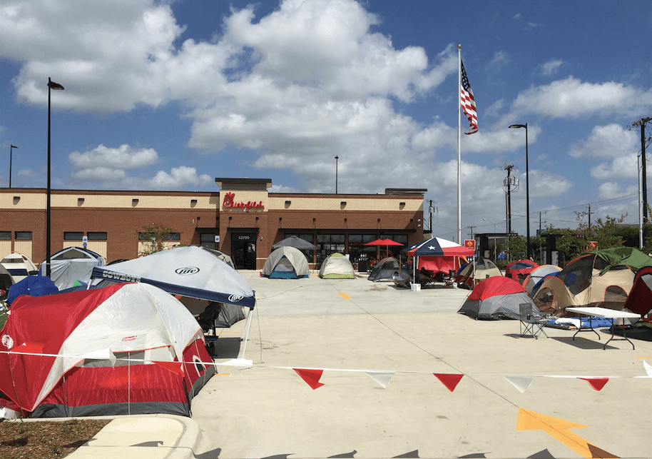 Campers hope for a year's worth of free chicken at the new Chick-fil-A near LBJ and Midway. (Photo by Lauren Law) 