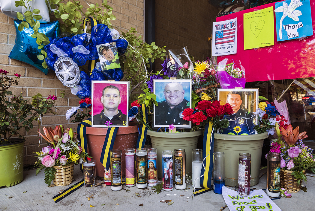 Supports and mourners set up memorials at the Dallas Police substation in the Oak Cliff following the shooting on July 7, 2016. Photo by Danny Fulgencio