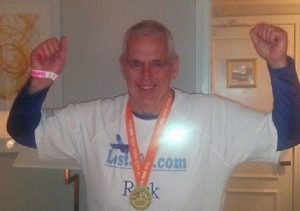 Rick poses after completing the New York Marathon in November. 