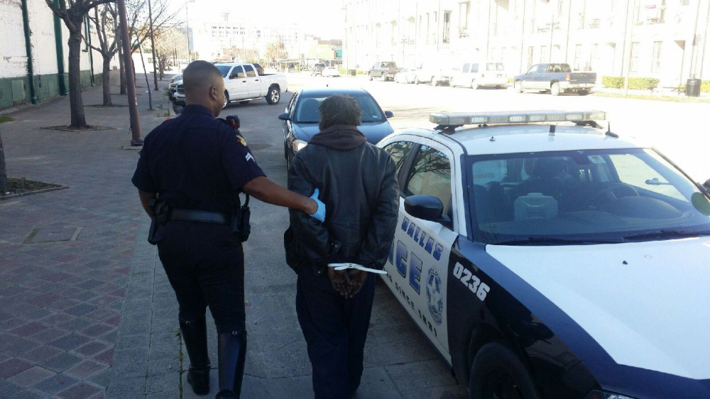 Police arrest a panhandler. (photo via DPDbeat.com)