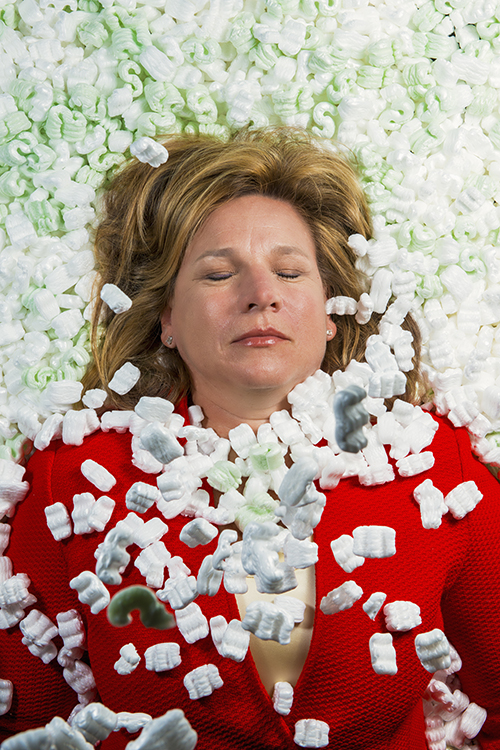 Dallas City Councilman Jennifer Staubach Gates buried in packing peanuts