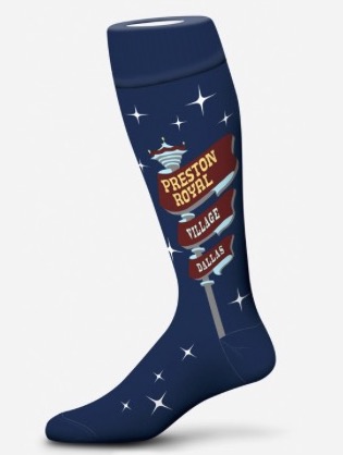 A tube sock sold by Ken's Man's Shop featuring the sign outside of the store, which says "Preston Royal Shopping Center." Stars are patterned intermittently around the sign.